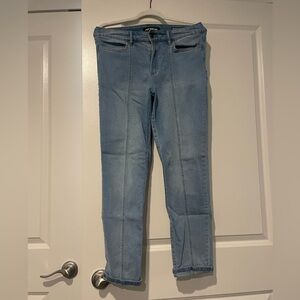 Joe fresh blue jeans with brown stitching down middle of both legs.